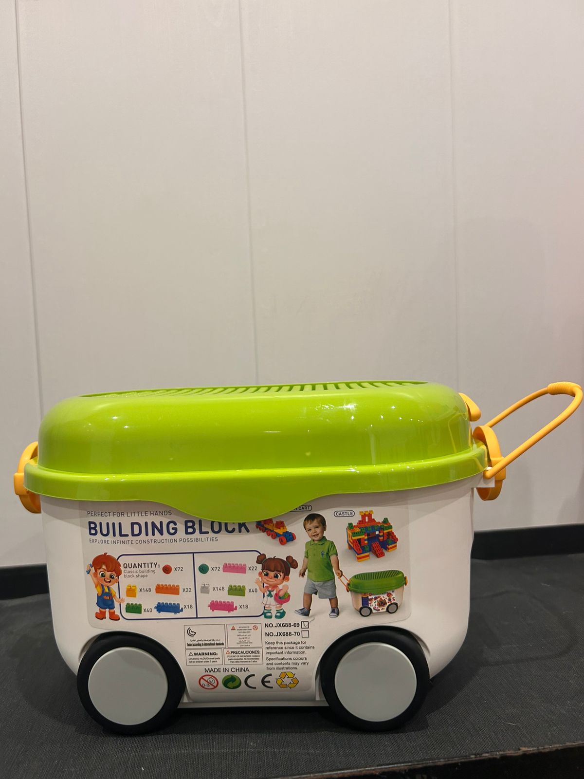rolling building blocks bin with green build-on lid and wheels