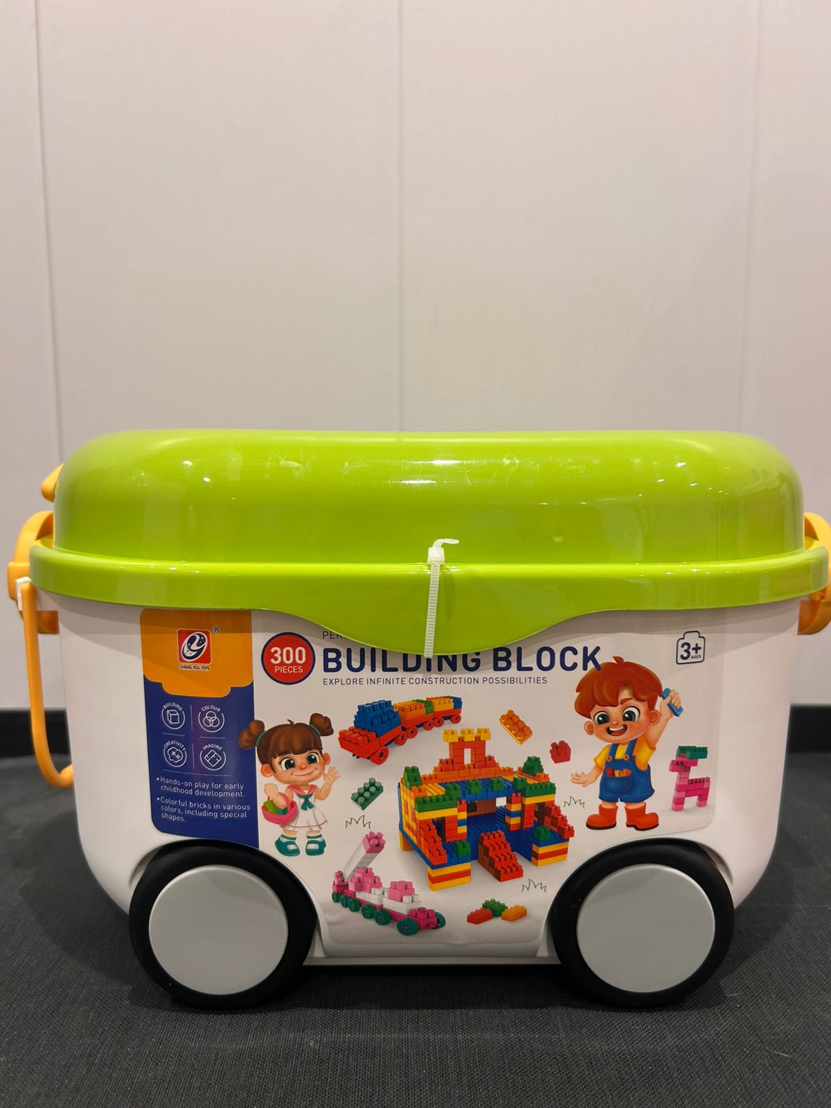 rolling building blocks bin with green build-on lid and wheels